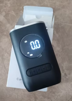 Digital wireless air compressor with display saying 0.0 air pressure.