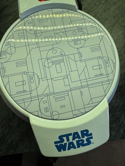 The Star Wars R2-D2 waffle iron closed up with a nice schematic like print on top.