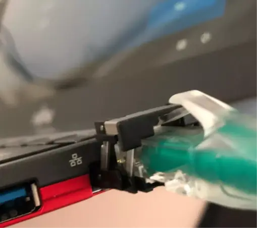 has an ethernet cord plugged in.