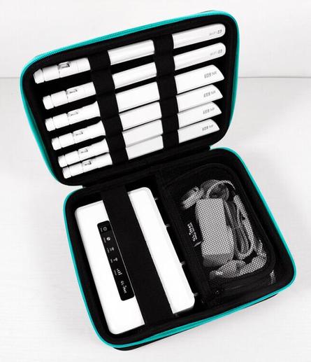 a white colored 4G LTE travel router in a carrying case with power supply and six external antennas
