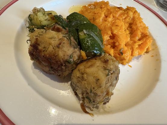 On plate: crab balls, diced zucchini, mashed sweet potatoes.
