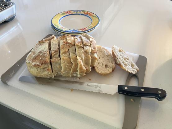 One sourdough loaf sliced up ready to make lunch.