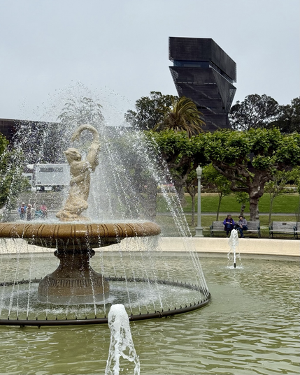 Fountain with mountain lion fighting snake in front of De Young Museum.