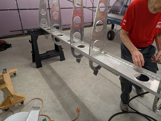 Mostly full view of wing spar with ribs attached