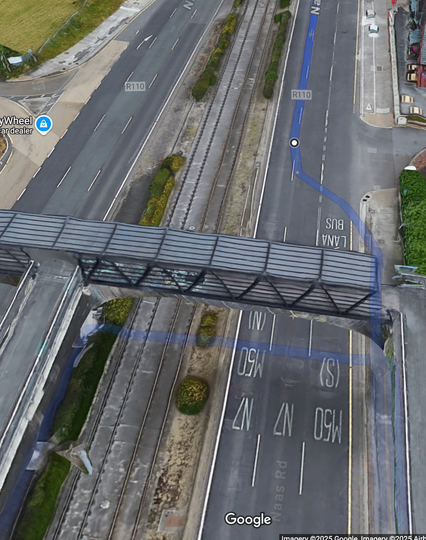 Is Google Maps really suggesting that I cycle through a hedge along the dual carriageway, then cross the Luas lines, then loop over and proceed the wrong way along the entry to the M50?