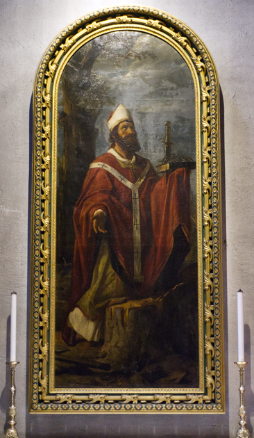 Das Bild zeigt ein Gemälde des Heiligen Bonifatius.
Er schaut andächtig nach rechts oben und hält eine durchstochene Bibel in der Hand.