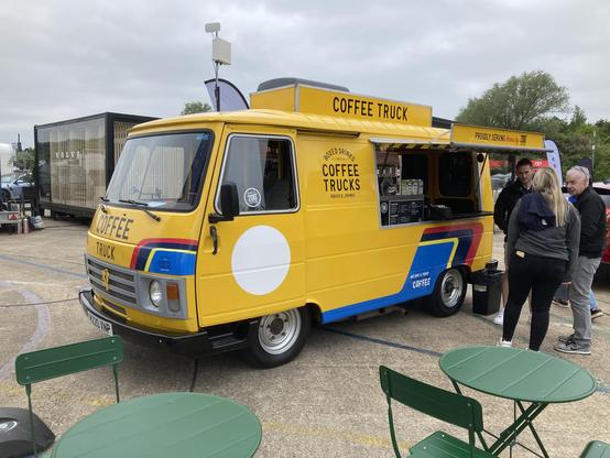 Yellow Peugeot J9 converted for use as a catering van, side view, showing serving hatch