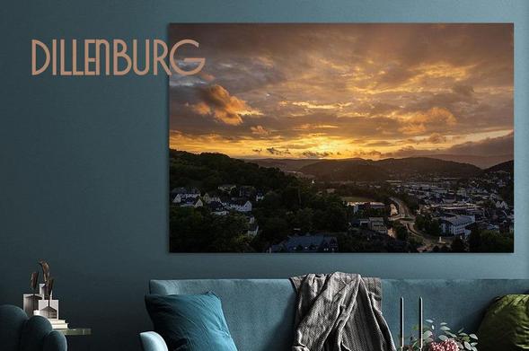This beautiful sunset photo captures the vivid colours of the setting sun over the city of Dillenburg, in Hesse, Germany creating a stunning display of nature's artistry.
