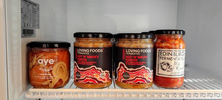 Four jars with Kimchi made in Scotland  in a fridge in a shop inAberfeldy