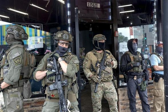 Police and ICE agents "guarding" a taqueria in Minneapolis