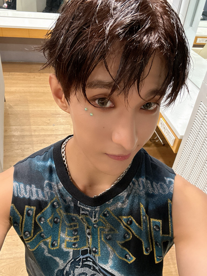 DK taking selfies backstage at MCountdown. Attempting an innocent look for the camera.