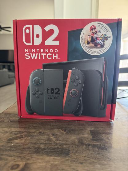 Nintendo switch 2 box on a wooden table.
