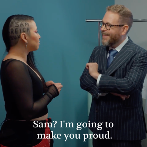 A screenshot of Erika Ishii telling "I'm going to make you proud" while also having the words "Sam Reich Sux" shaved into the side of her head.