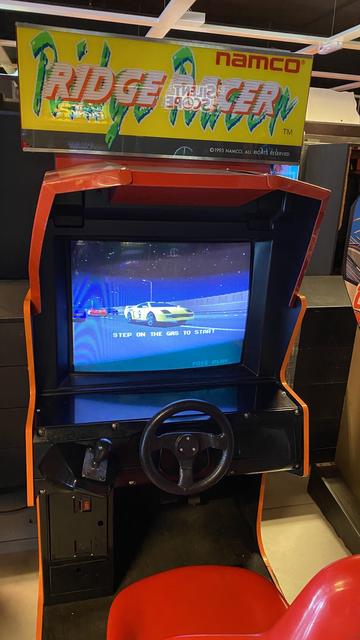 Namco’s 1993 Ridge Racer arcade cabinet at The Heart of Gaming retro arcade in London, UK
