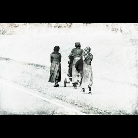amish women walking on the road side, black and white photography