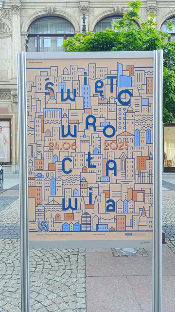 A photo of a poster with orange and blue buildings