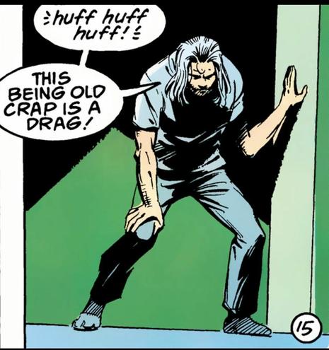 An elderly man in gray T-shirt, pants with long grey hair is leaning against the door frame. “Huff huff huff! This being old crap is a drag!“