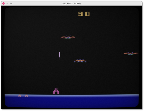 🕶️ A view of the game Demon Attack (a kind of Galaxian in which 3 ships move in various motions and shoot at the player's ship at the bottom of the screen) running on Gopher2600 on my Linux PC.

📚️ Gopher2600 is a libre, multi-platform emulator of the Atari 2600. It's highly accurate, and among other things offers emulation of 6507, TIA and RIOT chips, supercharger, Harmony, UnoCart and PlusCart cartridges, stick, paddle, keyboard and SEGA Genesis-type controllers, and support for the network, AtariVox and SaveKey, CRT TV effects, screen capture, game recording and playback, game rewind, ROM selection with live preview, boxart. Its graphical debugger allows interaction at CPU and color clock level, breakpoints, traps, watches on various CPU, TIA and RIOT targets, and ARM monitoring.