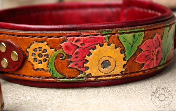 A photo of just the leash, which has the same flowering vines and gears motif as the collar