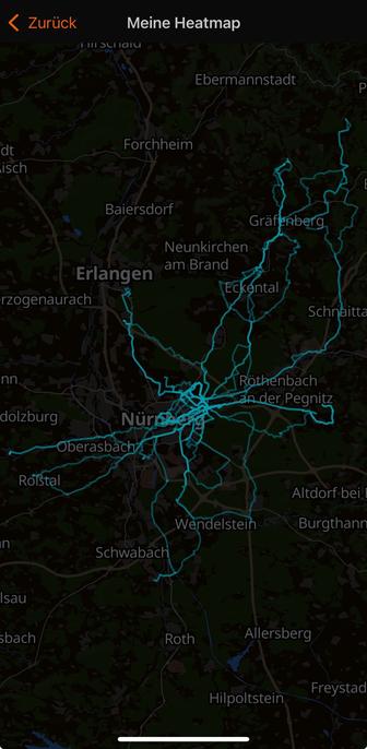 A dark map with a light blue heatmap overlay indicating routes and activity in the areas around Erlangen and Nuremberg, Germany.