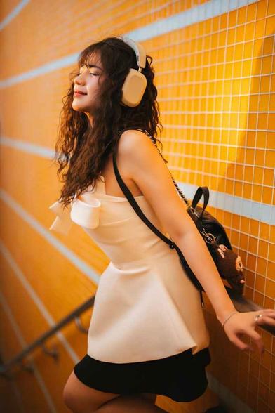 relaxed woman enjoying music with headphones