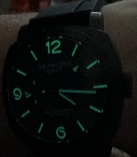 The lume shining through from behind the watch face.