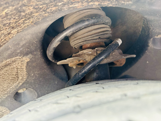 Offside front spring has decided to take a costly trip southward.