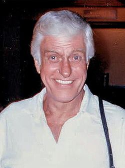 Dick Van Dyke, a while guy with white hair, smiling. Photo taken in 1988.