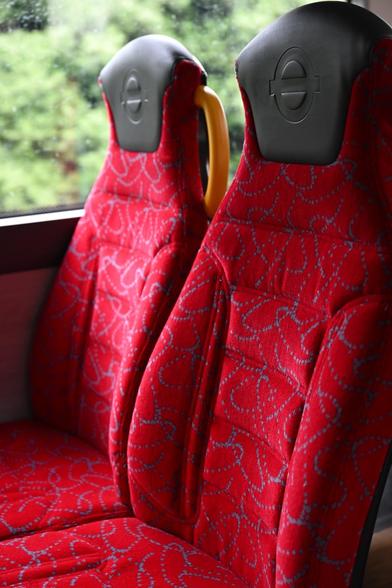 TfL image – Bus interior – red moquette on seats