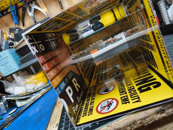 A taped together aluminium box, made from scraps of angle and mi's-printed signs.