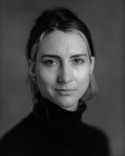studio headshot of a young woman
