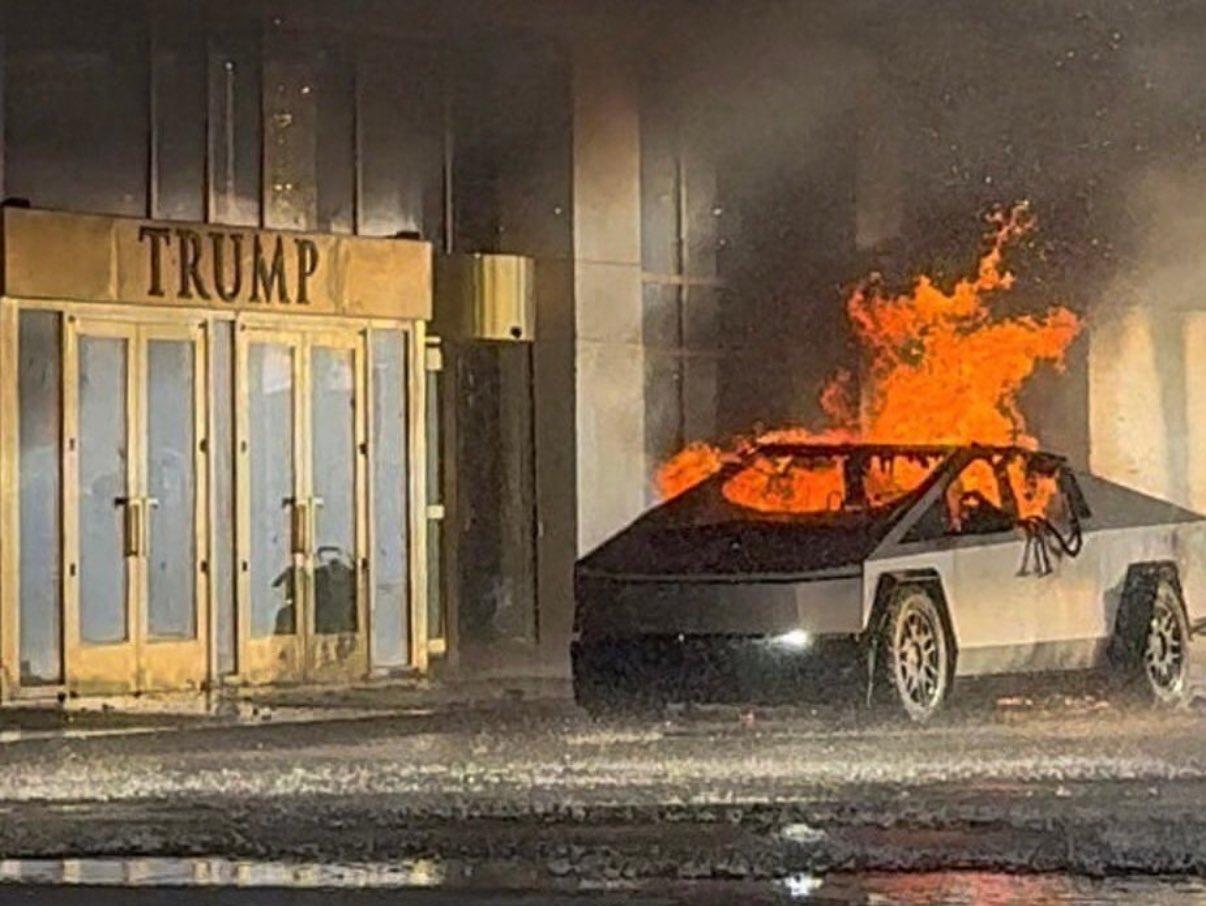 A cybertruck on fire in front of a Trump hotel
