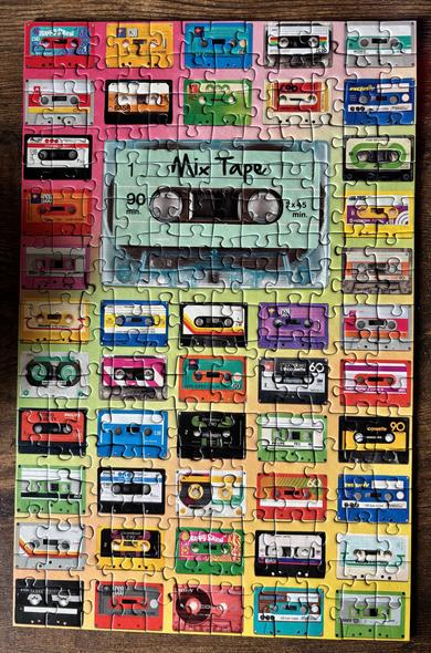 A 200 piece jigsaw puzzle filled with vintage cassettes in a multitude of colours. The puzzle is called mix tape I guess?