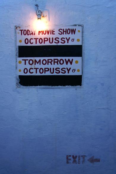 A hand-painted sign from a rooftop terrace of a hotel in Udaipur, India. The sign reads:

Today movie show
Octopussy

Tomorrow
Octopussy

There are blank spaces for other movie titles to be added, but it's clear that they never are.