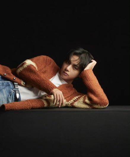 Taehyung for Celine in W Korea Magazine. Reclining on orange sweater.