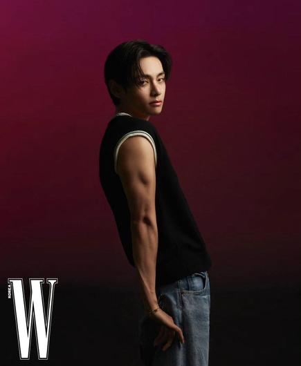Taehyung for Celine in W Korea Magazine. Red background, black vest, biceps, stop looking at us like that TaeTae!