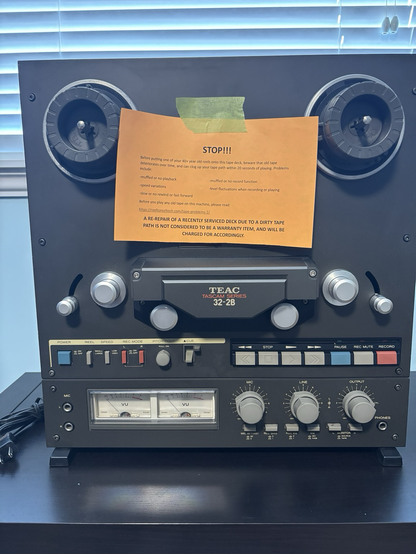 My TEAC 32-2B reel-to-reel tape deck back from repairs in Vancouver. Also complete with warning about using shitty tapes (ie older ones) that will clog up the tape heads very quickly.