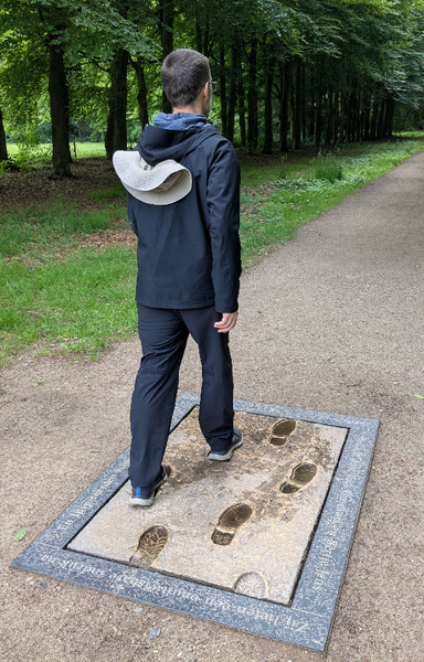 me posing on the official halfway marker for the Pieterpad