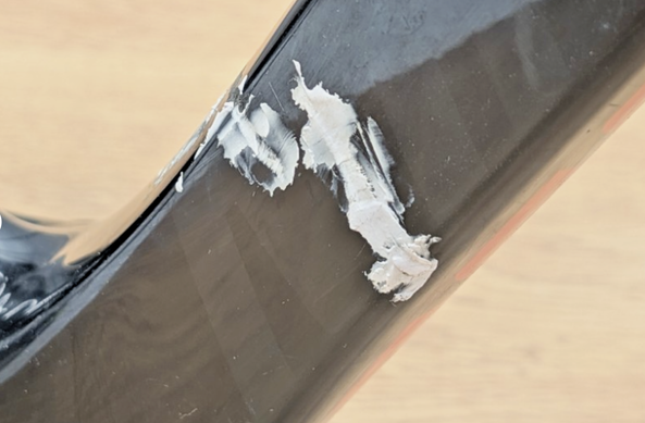 badly filled, what looks remarkably like a, crack on a carbon frame section