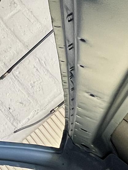 Staples which had held original headliner tackstrip