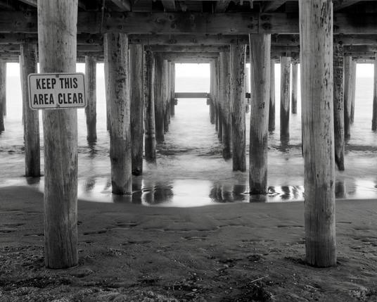 Surf under a pier