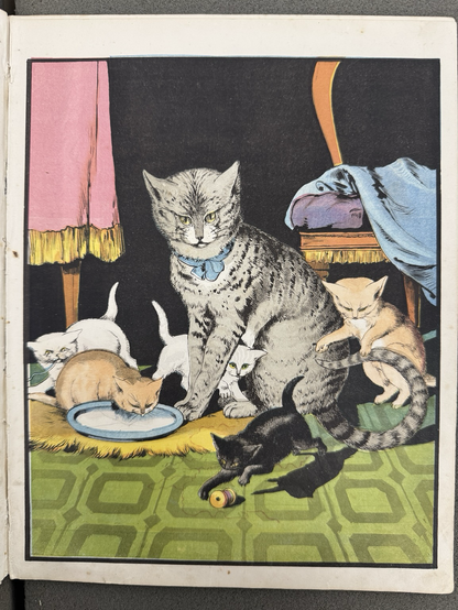 photos of four color book illustrations #2: grey cat with 5 kittens (2 white, 2 orange, 1 black) playing inside at home (table and chair in background, green tile floor, bowl of cream)