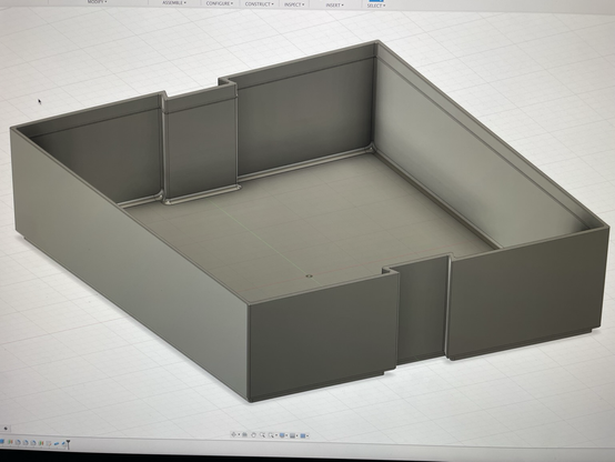 3d render of a 3d model of a box, created in fusion360. The box has slots on the front and back that a key shape fits into so they can be interlocked for easy access and labels.