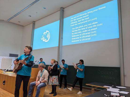Holger on guitar with team, karaoke lyrics for Dancing Queen
