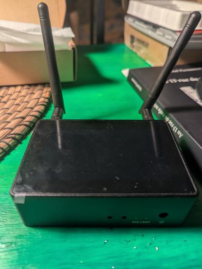 A Friendly Electric Nanopi Mp with wifi and Bluetooth antennas which seem incredibly large compared to the single board computer it's self.