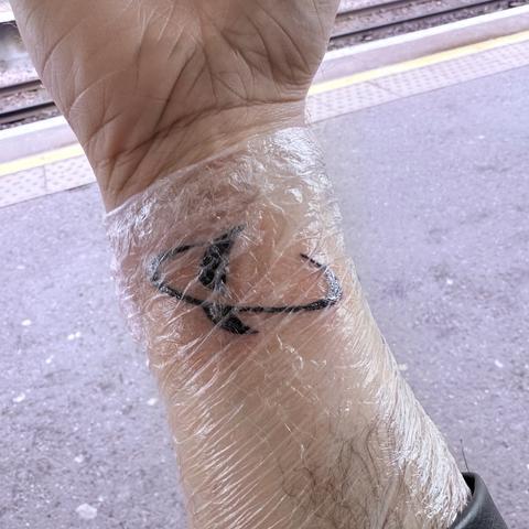 Tattoo of Saturn on my right inner wrist
