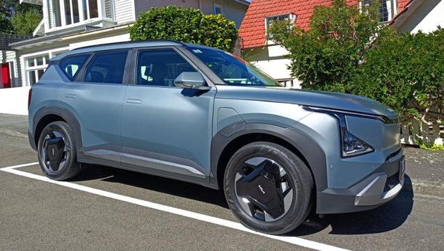 Kia EV5 in a metallic turquoise shade.