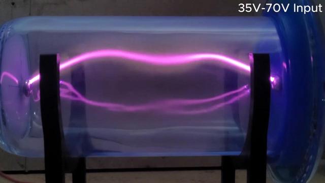 [ImageSource: Simranjit Singh]

[Simranjit’s] build begins with a nice large 1.4-liter kombucha bottle from the Synergy brand. To make the plasma tube nicely symmetrical, the bottle had its original spout cut off cleanly with a hot wire, with the end then sealed with a glass cap.

Electrodes were installed in each end of the tube by carefully drilling out the glass and installing small bolts. They were sealed in place with epoxy laced with aluminium oxide in order to improve the dielectric strength and aid the performance of the chamber. A vacuum chamber was then used to evacuate air from inside the chamber.