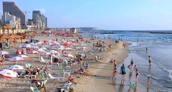 Israeli people enjoy the beach