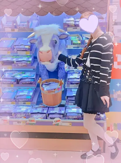 A girl petting a purple cow plush in a store